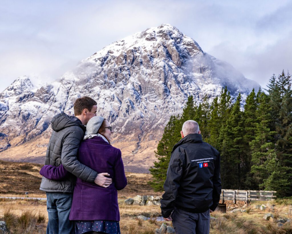 Tour guide with 2 tourists in Scotland